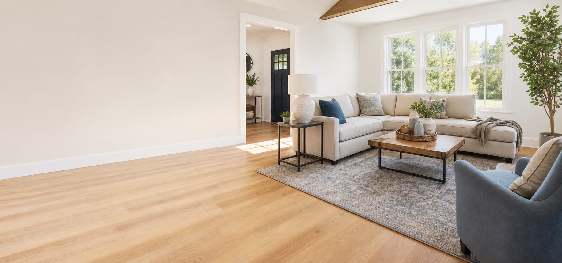 Sunlit living room with fresh light flooring